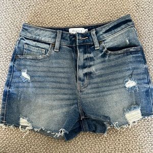 High rise denim shorts, they have stretch to them.